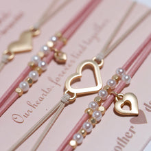 Load image into Gallery viewer, K'lani hair tie bracelets - "Mother / Daughter" Pink with Pearls & Gold Hearts Shareable Hair Tie Bracelets