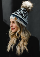 Load image into Gallery viewer, White, Black, Blue &amp; Tan Patterned Pom Hat
