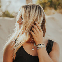 Load image into Gallery viewer, K'lani hair tie bracelets - "Inspire" Grey &amp; Black with Gold Flower Accent Hair Tie Bracelets
